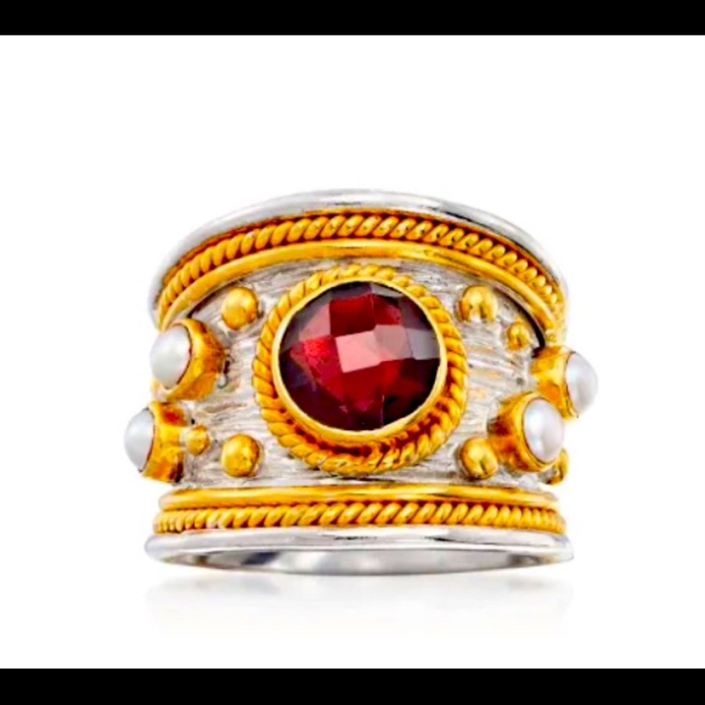 THIS REGAL EYE CATCHING GARNET AND PEARL RING